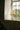Acropolis table lamp on a window ledge with green garden view