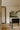 Trace Linear chandelier above a kitchen island with a marble top, seen from across the room