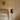 Pendulum floor lamp beside a bed in a bedroom