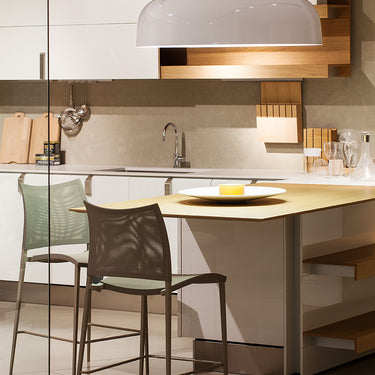 Canopy ceiling suspension light by Oluce installed in contemporary living room