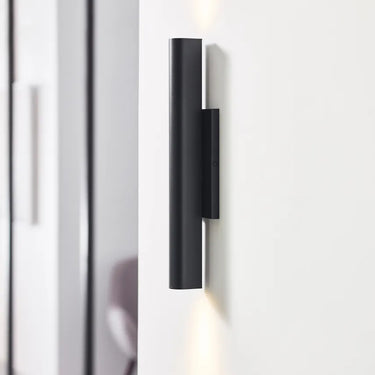 Chara 16 black modern industrial outdoor light, providing warm 3000K LED illumination.