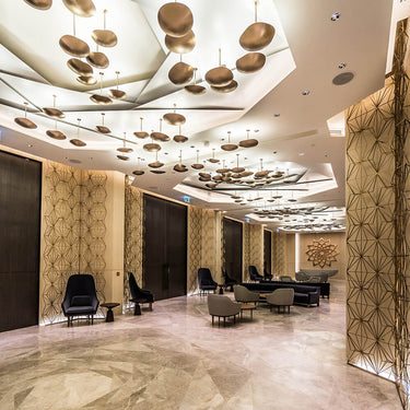 Viso Chestnut champagne plate light installed in an interior, view 1