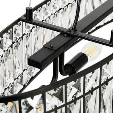 Black Oval Chandelier Illuminating a Kitchen Island