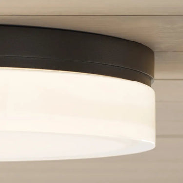 Antique bronze round flush mount hallway light, Cirque 11 inch wide, energy efficient LED, installed on ceiling, dimmable functionality