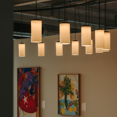 Modern circular pendant lighting fixture for dining and hospitality spaces