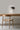 Ciro Wall light by Pablo Designs in Graphite, mounted above a desk