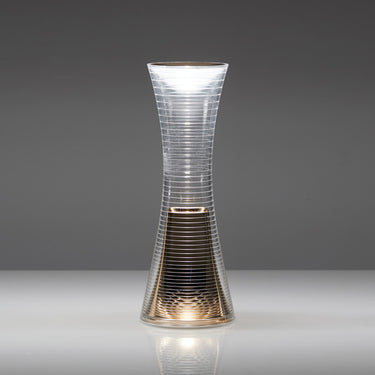 Come Together portable light by Artemide placed on modern nightstand