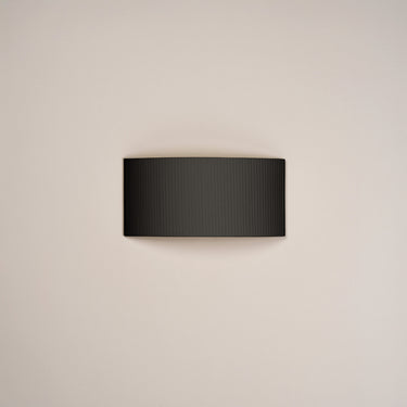 Modern Black Ribbon wall sconce by Santa & Cole for bedroom and hotel lighting interiors