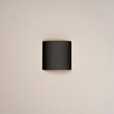 Black Ribbon Comodin wall light by Santa and Cole for bedroom and hotel interiors