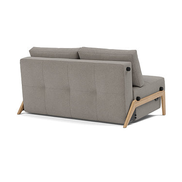 Cubed sleeper sofa with oak wood legs upholstered in 521 Mixed Dance Grey fabric