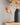 Warm light emitted from the Daqiconcept Bird LED Dimmable Table Lamp - Burnt Brick BR01BBL in a cozy living room