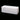 Studio view of a white La Fête Dash bench on a black background
