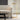 Dessau floor lamp, illuminated arm rotated, showcasing directional task light, brass finish