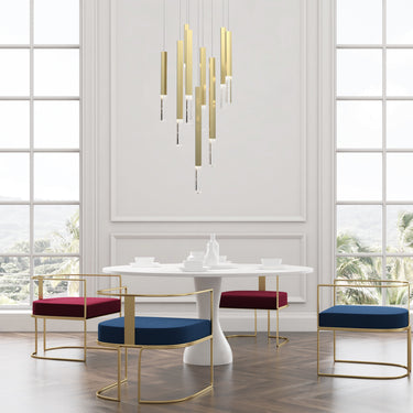 ET2 Diaphane gold rock crystal pendant cluster hanging over a round table in a white paneled dining room