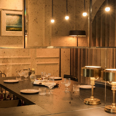 Penta Storm pendants above a dining table at night