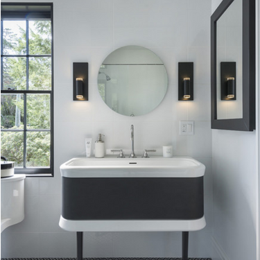 Dobson II 1-Light crystal ring vanity light glowing in a spa-like bath