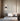 ET2 Cortex wall sconce in Black mounted above a bed in a neutral bedroom