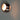 ET2 Wink wall sconce, Satin Nickel, close-up lit with warm light from the openings