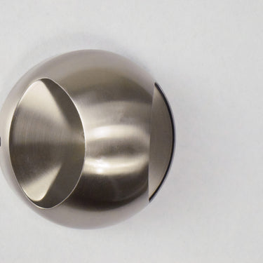 ET2 Wink wall sconce, Satin Nickel, angled unlit view of the half-dome on a pale wall