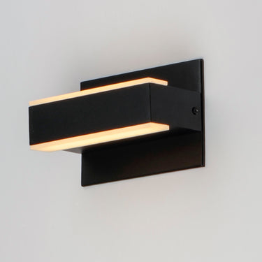 ET2 Omni Black wall sconce, three-quarter view of the glowing light bar