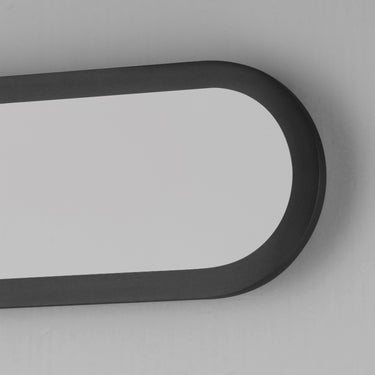 ET2 Latitudes slim oval bath sconce, 18 in Black, close-up of the rounded end and white diffuser