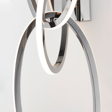 ET2 Unity wall sconce, Black Chrome, close-up of the glowing LED loop and polished ring