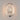 ET2 Moonscapes Polished Chrome oval wall sconce lit, warm glow behind the textured panel