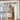 ET2 Soji lantern glass wall sconce above a kitchen counter beside a pantry doorway