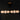 ET2 Soji 60 in pendant, lit warm glowing glass lanterns against a dark background