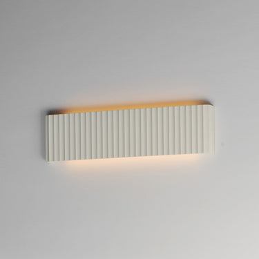 ET2 Delphi concrete panel bath vanity light, 24 in, lit with warm glow along the top and bottom edges
