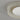 ET2 Matera 13 in Chalk White concrete flush mount, close-up of the speckled concrete ring and frosted white glass dome