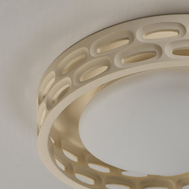 ET2 Cambria 13 in flush mount close-up of the oval cutouts in the plaster ring and the white glass underside