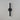 ET2 Reveal Outdoor banded tube wall sconce, 20 in Black, slim black tube on a round wall plate, angled view