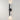 ET2 Reveal Outdoor banded tube wall sconce, 20 in Black, lit with light washing up and down a pale wall