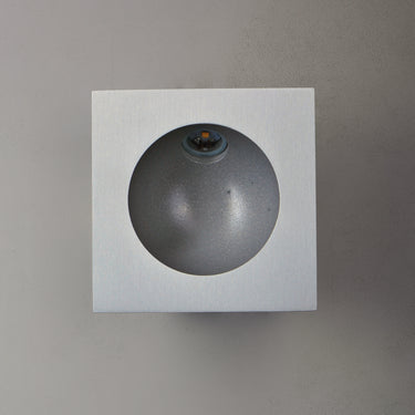 ET2 Alumilux Step Light low voltage outdoor wall light, Satin Aluminum, square plate with a round recess and small LED, angled studio view