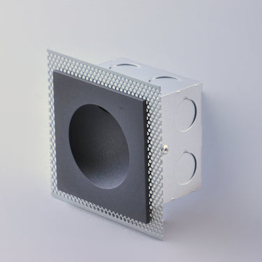 ET2 Alumilux Step Light rough-in box, metal box with perforated flange, shown with a black square faceplate fitted in front