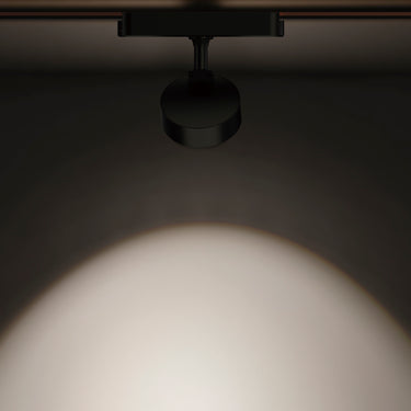 ET2 Continuum Optical track light, Optical Black, soft white pool of light on a dark wall
