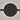 ET2 Continuum Wall Washer track light, Round, black round disc glowing with a warm halo on a gray wall