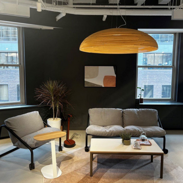 Float cardboard pendant light by Graypants hanging in a contemporary apartment