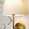Emily Cordless Wall Sconce Antique Brass by Modern Lantern mounted on a modern wall