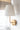 Antique Brass Emily Cordless Wall Sconce by Modern Lantern in a luxury home