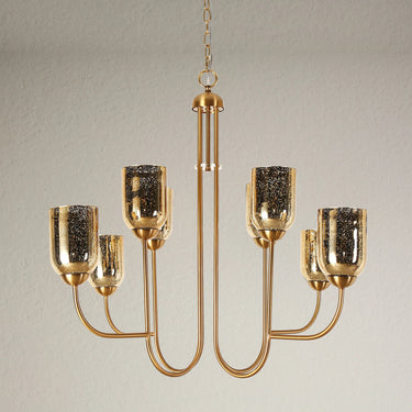 Gold Chandelier illuminating a dining room with Goblet-Shaped Shades
