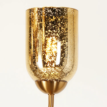 Close-up of Goblet-Shaped Glass Shades on a Gold Chandelier