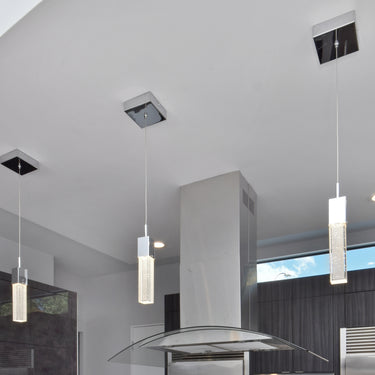 ET2 Fizz III mini pendants beside a stainless steel range hood in a dark slate-wall kitchen