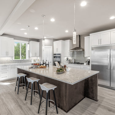 ET2 Fizz IV bubble glass pendants over a long dark kitchen island with gray stools and white cabinets