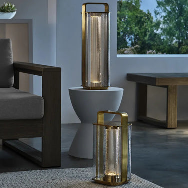 Compact brass LED lamp with 3-step dimming, rechargeable battery, and Murano-inspired glass