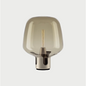 Lodes Flar large floor lamp in champagne finish with honey hand-blown glass shade.