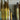 Close-up of ET2 Flute gold and chrome tubes of different lengths hanging beside a potted plant