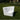 White Goal corner module on a lawn in front of a clipped hedge
