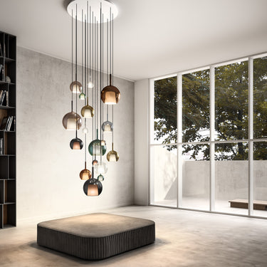 Cluster of Penta Glo pendants in different sizes hung at varied heights